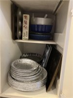 entire cupboard full of baking pans + tins