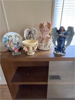 Assortment of angel figurines and a hummingbird