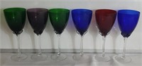 6 colored wine glasses on clear stems