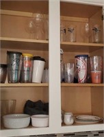 Contents of cupboard above sink - water glasses,