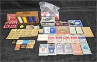 Group of vintage poker chips, playing cards,