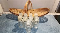 9 vintage spice bottles with a cool wicker basket