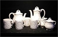 Coffee and tea set with four cups, cream and