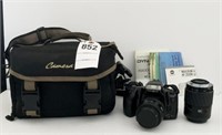 Minolta camera with camera case, additional lens,