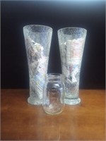 Two shattered glass vases