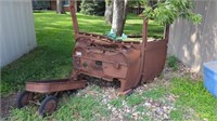 RUSTY FRONT OF A CAR AND DOOR AND AN OLD WAGON