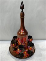 Wooden decanter six glasses and plate