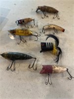 Old fishing lures. Appear to be mostly wood.