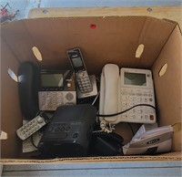 Box of phones and alarm clock