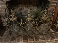 Ornate brass and glass fireplace screen with