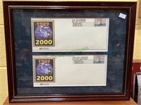Two framed envelopes celebrating the millennium.