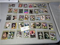 TRADING CARDS IN PROTECTIVE SLEEVES