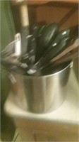 Stainless Steel stock pot full of kitchen utensils