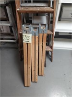 Two sets of wooden sawhorse legs