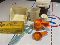 Lot of vintage Tupperware items measuring cups