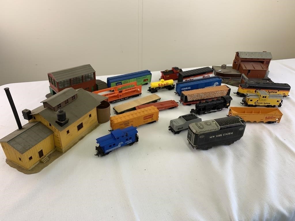 Assorted train cars, buildings
