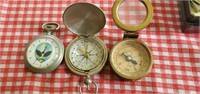Alien pocket watch, and two vintage compasses