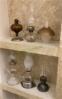 Lot of five oil lamps - metal and glass.