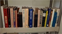 Shelf of 25 books with health religion and more
