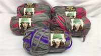 D1) FIVE SKEINS OF THICK YARN