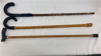 Three wooden canes