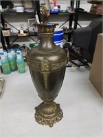 I believe this to be a brass ornate lamp base 24