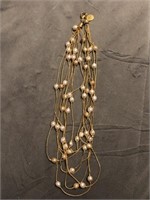 Yellow metal braided necklace with fake pearls