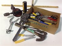 Hand tools including manual drill, pipe wrench,