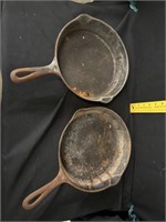 2 unmarked 9 inch cast iron pans