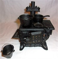 Miniature cast iron wood stove.
