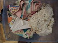 Container of vintage linens: quilt,