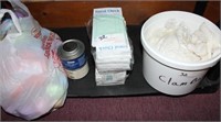 shelf lot- container of clam bags, stack of guest