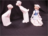 Three Lladro figurines: boy and girl in
