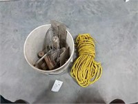 assortment of rope and hand tools