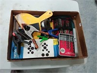 assortment of drill bits, clamps, punches