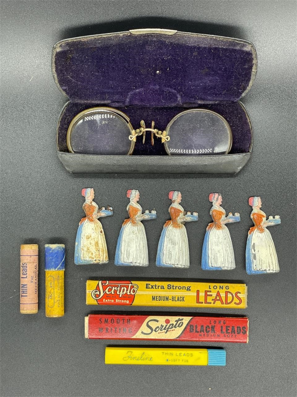 Antique pencil sharpeners, lead, and eyeglasses