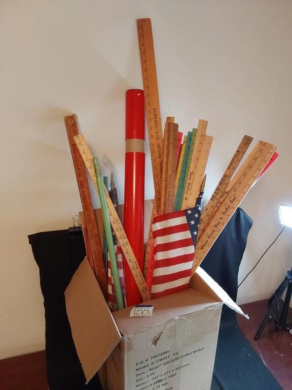 Box Of Yard Sticks and USA Flags