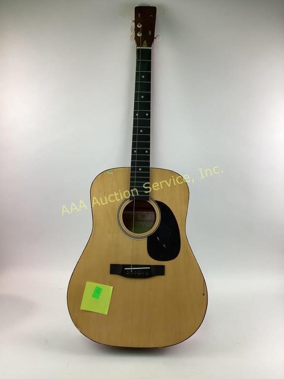 Yamaha C – 4 Acoustic six string guitar.