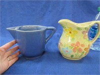 2 small pottery pitchers