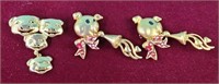 Pigs playing horn pins. 4 pig head pins, brooches