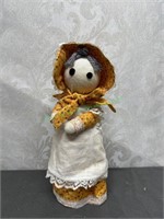 Bottle doll with yellow floral dress and bonnett