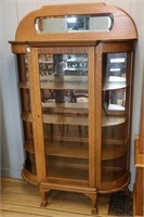 BOW FRONT GLASS DISPLAY CABINET WITH MIRRORED BACK