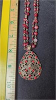 Beaded necklace with pendant.