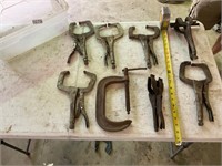 8 assorted clamps and bin
