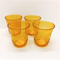 Four plastic cups yellow