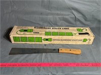 Fluorescent utility light and machete