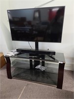 40" Samsung TV, sound bar, and TV stand