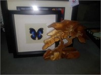 Wooden sculpture and butterfly picture