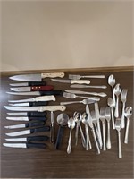 Assortment of kitchen knives and silverware
