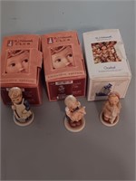 3 Hummel club figurines in the boxes.